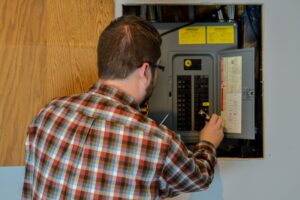 electrician-working-on-circuit-breaker-panel